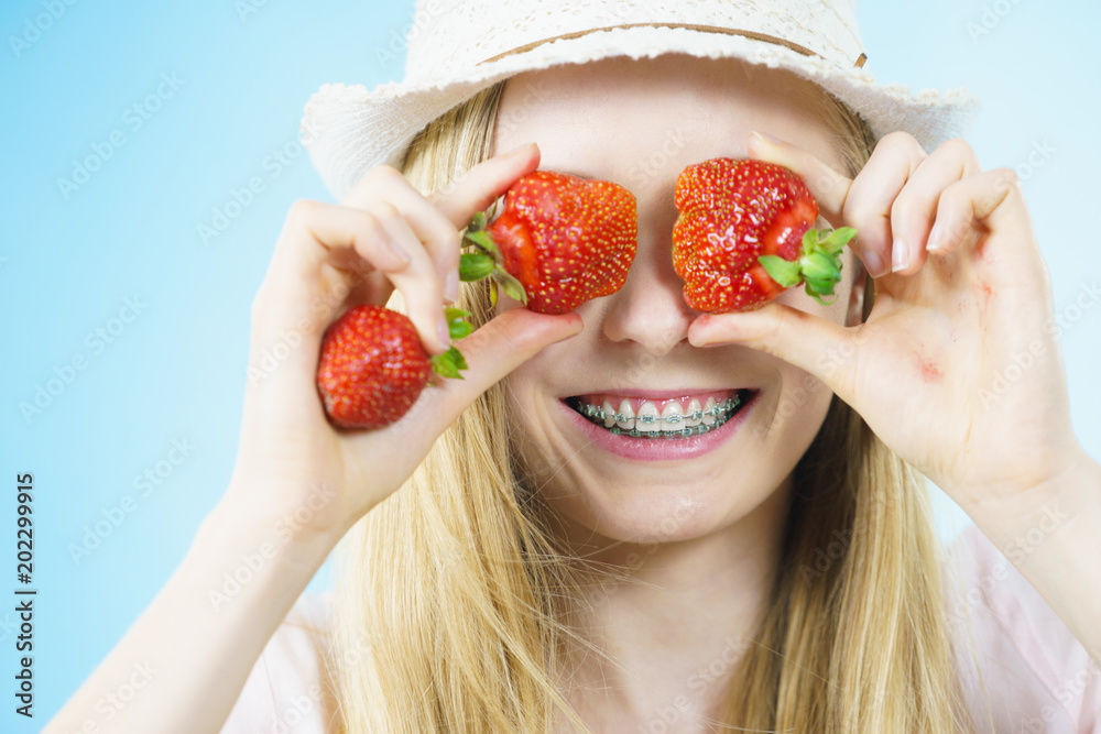Young woman with fresh strawberries Young woman with fresh strawberries