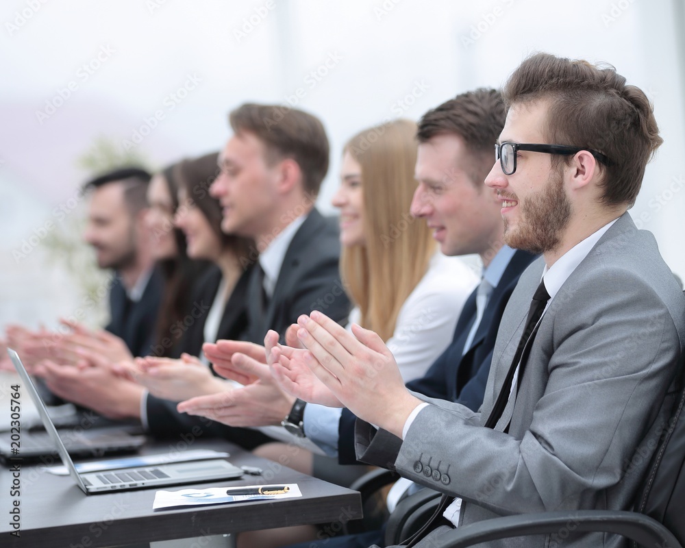 business team applauding the speaker at the meeting