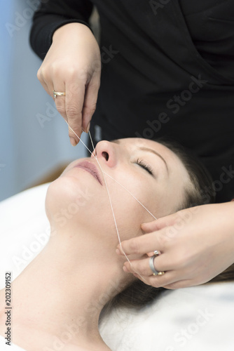 woman in a Threading