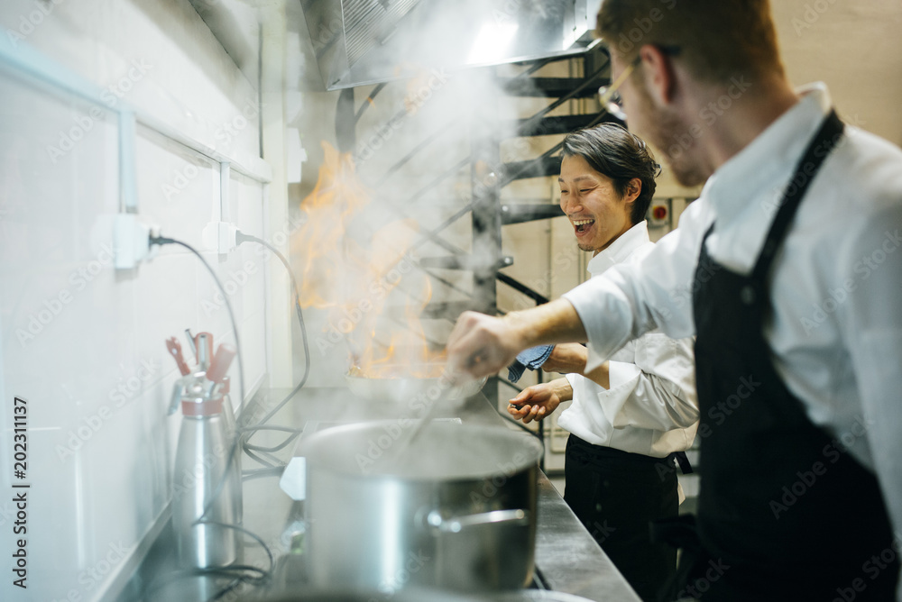 The cook making a flambe The cook making a flambe