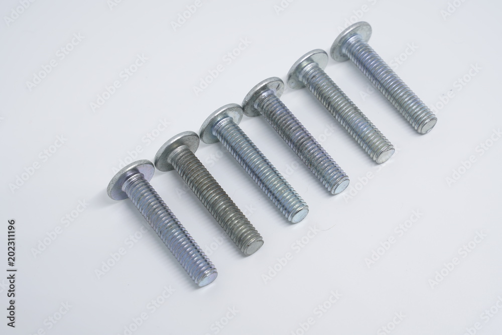 Dowels and screws on a white background Dowels and screws on a white background
