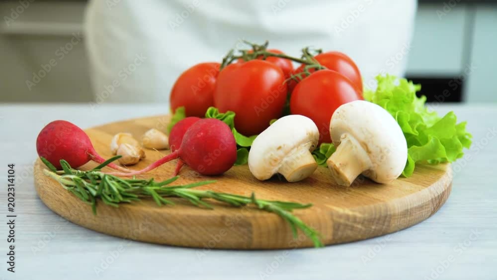 Healthy foods, cooking and vegetarian concept. closeup man hands laying ingredients for cooking vegetarian food Healthy foods, cooking and vegetarian concept. closeup man hands laying ingredients for cooking vegetarian food