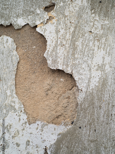 Damaged grey plastered wall next to new masoned stone wall, Old next to new, Renovation works, Building repairs. photo