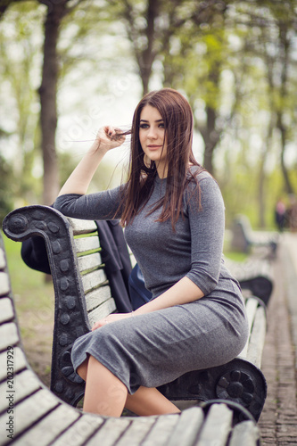 girl posing on bench