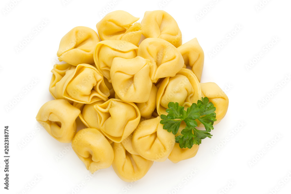 Raw homemade pasta,tortellini with herbs. Raw homemade pasta,tortellini with herbs.