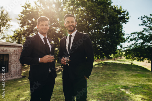 Groom and his friend at wedding party photo