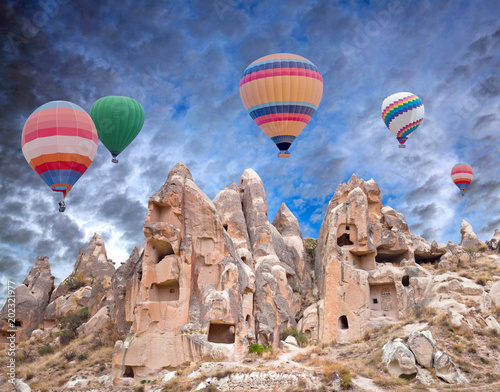 Colorful hot air balloons flying over Cappadocia, Anatolia, Turkey