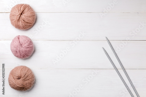 Wool skeins of thread on white boards. a ball of thread from the Italian angora. knitting