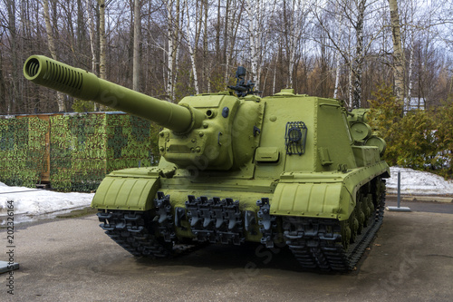 Tracked heavy tank stands in the Parking lot photo