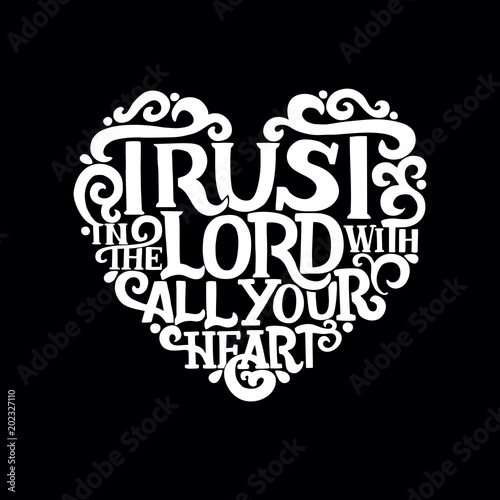 Hand lettering with bible verse Trust in the Lord with your heart on black background.