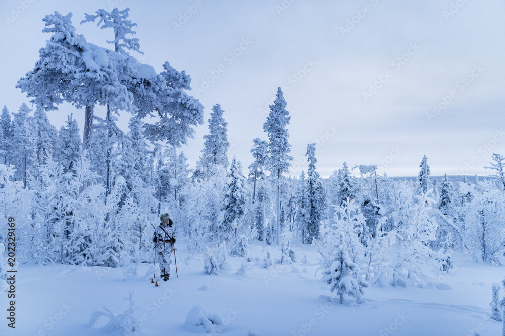 Hunters in winter forest Hunters in winter forest