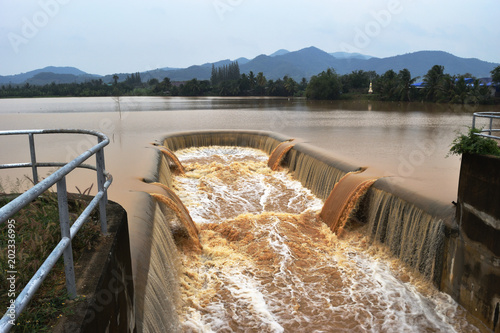 Obraz na plátně Turbid water in the dam overflows into the spillway  , Thailand