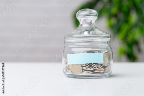 Glass jar with coins