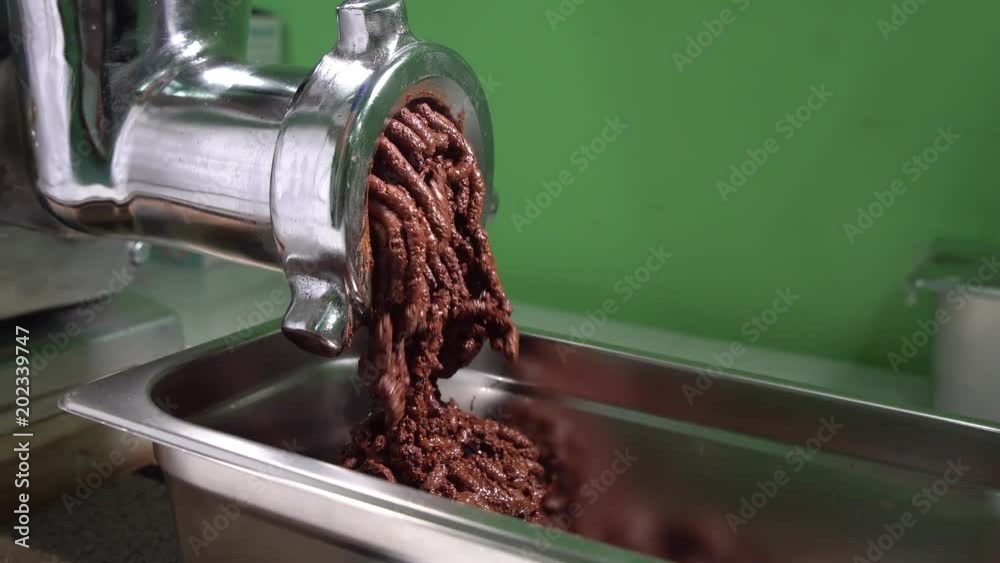 Cocoa nibs are ground into cocoa mass, unsweetened chocolate. Grinding