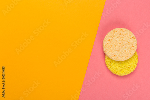 Cosmetic pumice on a bright  bicolor background, top view