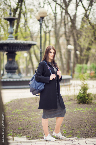 girl posing near the tree