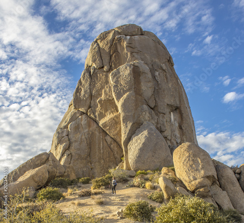 Toms Thumb Rock formation and hiker in North Scottsdale Arizona