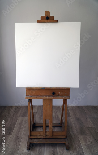 Art easel with empty canvas 