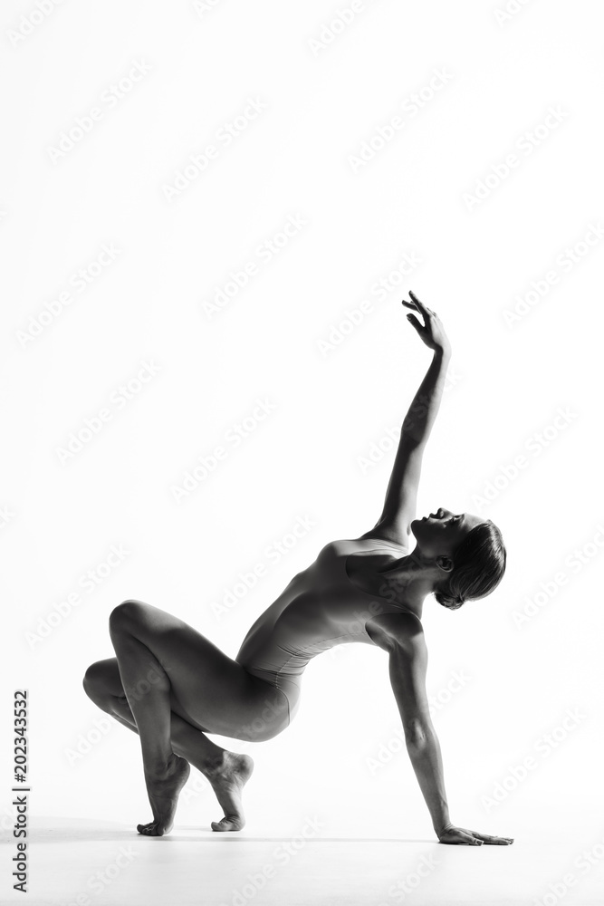 Young beautiful athlete is posing in studio Young beautiful athlete is posing in studio