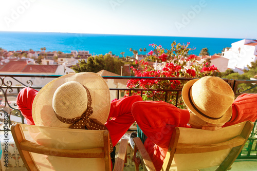 happy couple relax on balcony terrace, on vacation in Europe