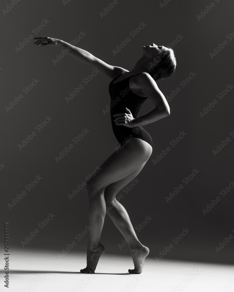 Young beautiful athlete is posing in studio