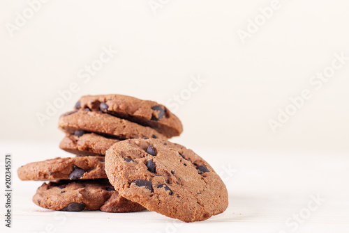 chocolate cookies on a light table and background