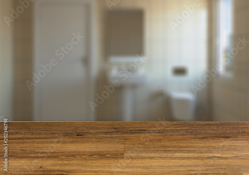 Background with empty wooden table. Flooring. The wooden table. Blurred interior.