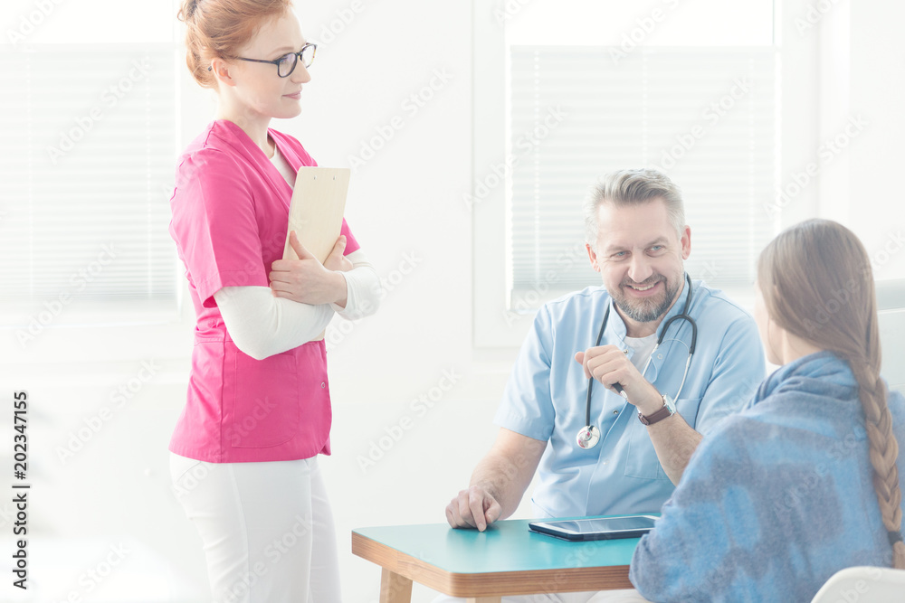 Doctor's assistant during medical interview Doctor's assistant during medical interview