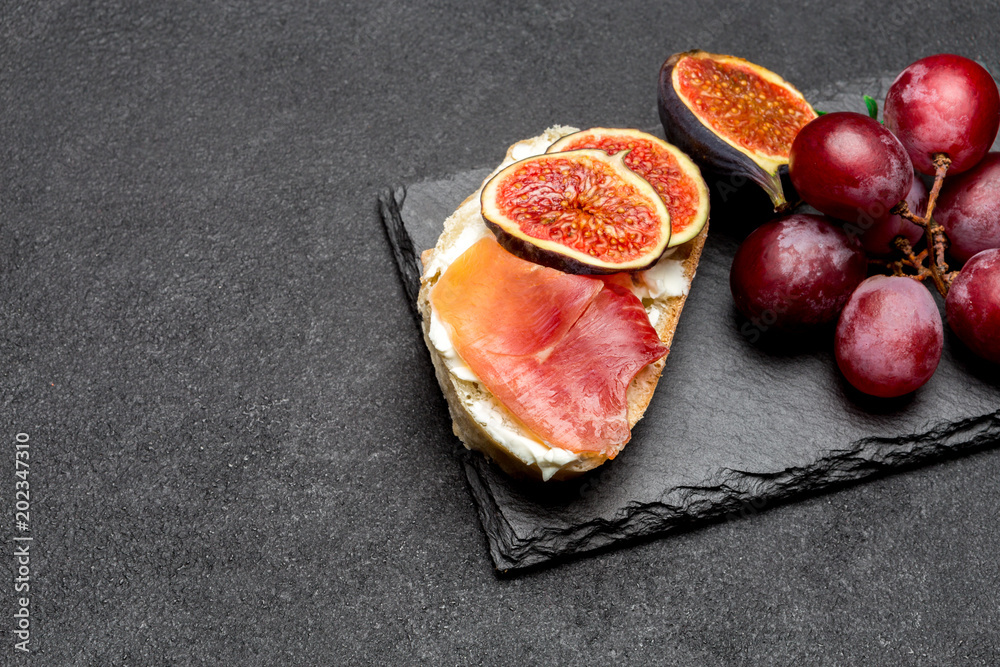 Bruschetta with ham, blue ceese and fresh figs Bruschetta with ham, blue ceese and fresh figs