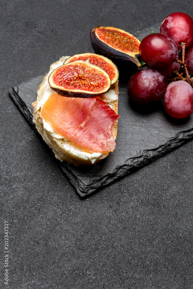 Bruschetta with ham, blue ceese and fresh figs Bruschetta with ham, blue ceese and fresh figs