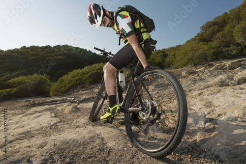 Cyclist with wheel without air