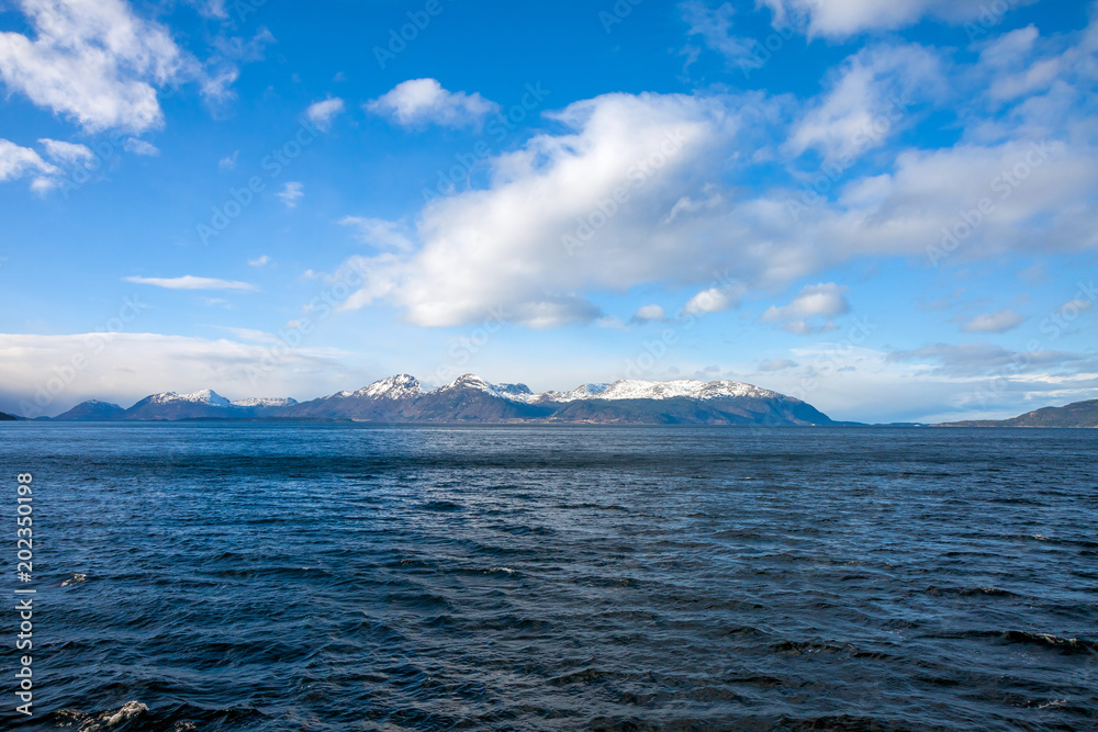 Fjord in Norway - nature background, view from ferry deck Fjord in Norway - nature background, view from ferry deck