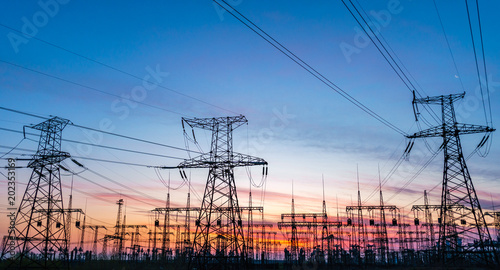 distribution electric substation with power lines and transformers.