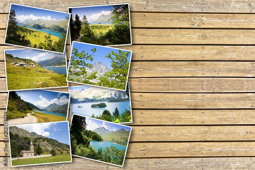 Sils lake in the Upper Engadine Valley in a summer day (Europe - Switzerland) - Postards concept on wooden background photo