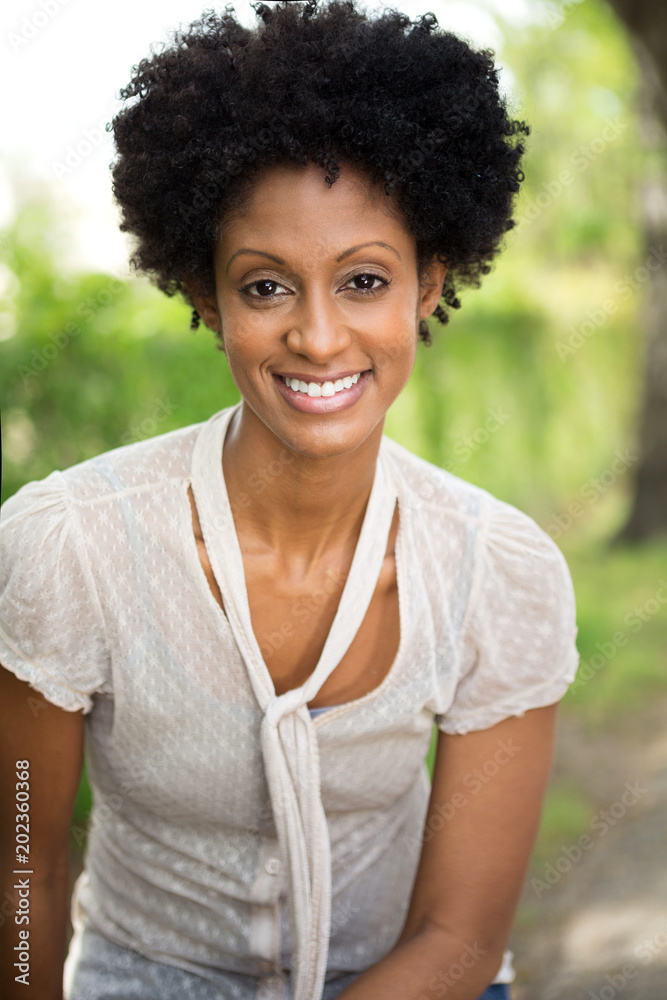 Beautiful woman smiling outside. Beautiful woman smiling outside.