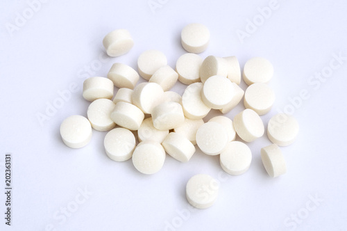 group of white medicinal pastilles