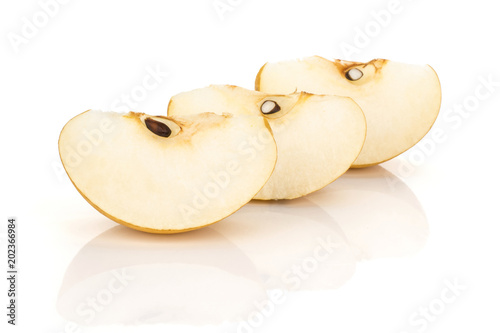 Three Chinese golden pear slices Nashi variety isolated on white background.