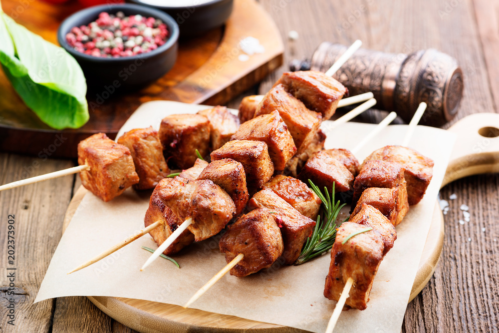 Barbecue meat. Grilled pork skewers on wooden table. Barbecue meat. Grilled pork skewers on wooden table.