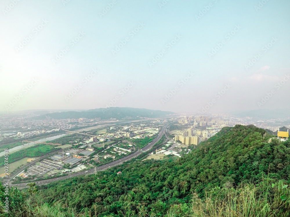 Overview cityscape city and mountation, photo shooting from the top of Mount in Taipei, Taiwan.