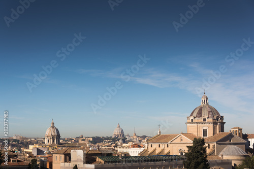 Church domes and rooftops of old buildings in Rome