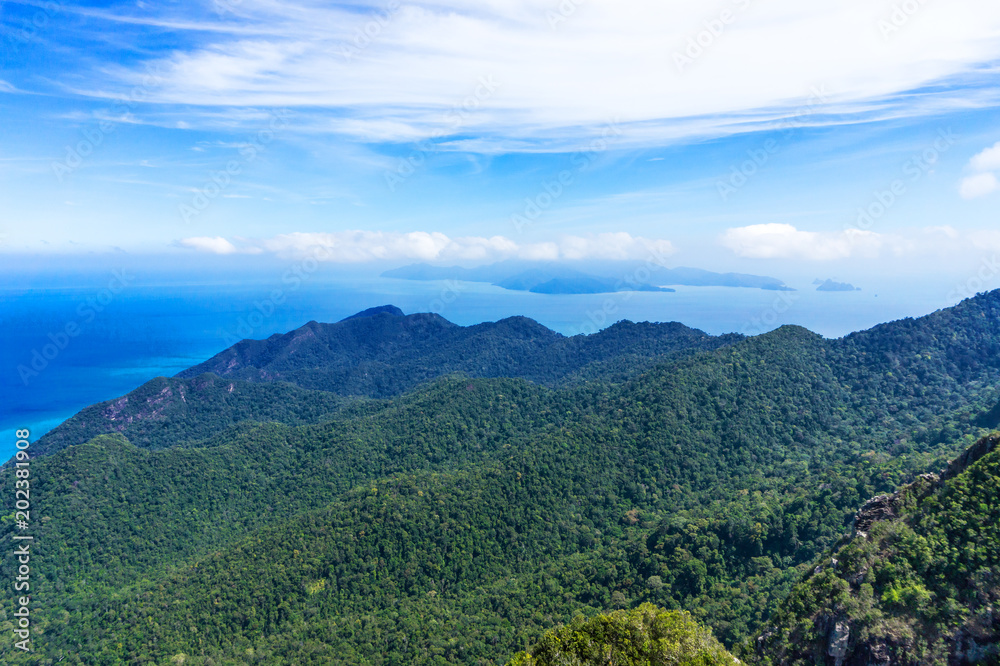 Tropical green mountains with cloudy blue sky, Malaysia