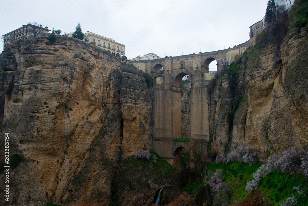 Fototapeta premium ancient bridge, connecting old and new part of andalusian town ronda over gorge el tajo of Río Guadalevín
