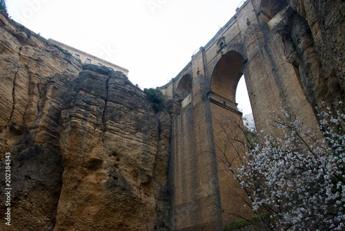 ancient bridge, connecting old and new part of andalusian town ronda over gorge el tajo of  Río Guadalevín