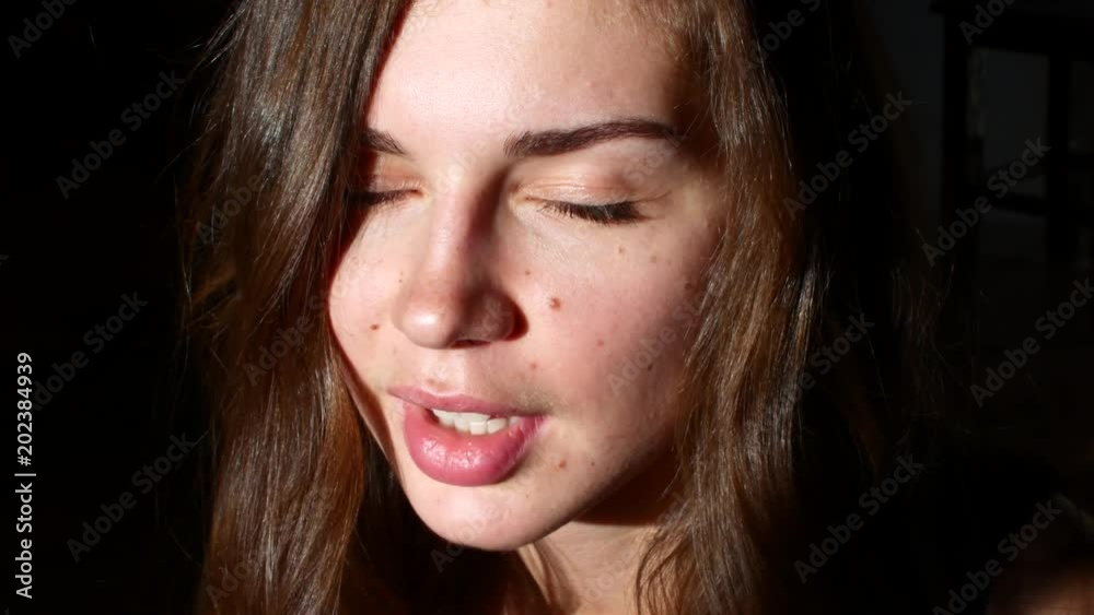 Laughing young woman in sunlight Laughing young woman in sunlight