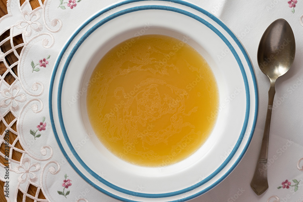 Chicken bone broth served in a plate Chicken bone broth served in a plate