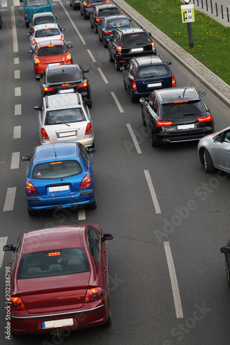 A row of cars waiting in a traffic jam for the possibility of further driving.
