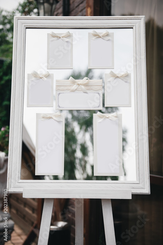 Obraz na płótnie Wedding Photography: Classic Seating Chart on a White Wooden Frame, copy space w salonie