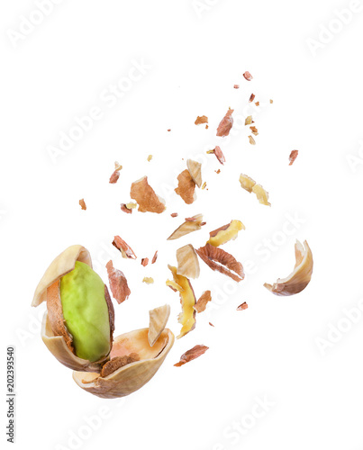 Pistachio crushed in the air close-up isolated on white