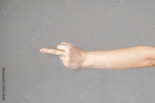 Woman hand showing middle finger on a white isolated background