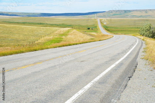 Long, lonely road in Montana stretches for miles.